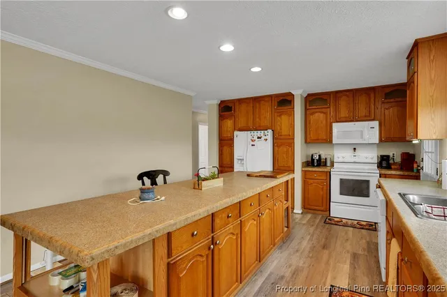 a kitchen with stainless steel appliances a sink stove and refrigerator