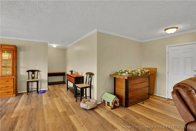 a view of workspace with furniture and wooden floor