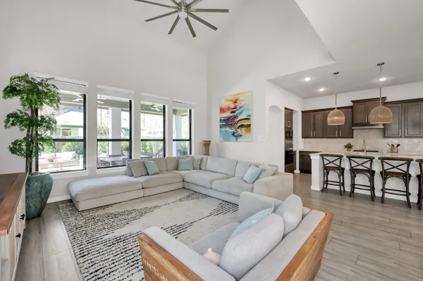 a living room with furniture and a large window
