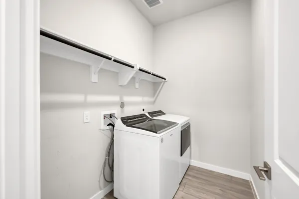 a utility room with washer and dryer