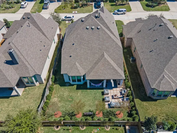 an aerial view of multiple houses with outdoor space