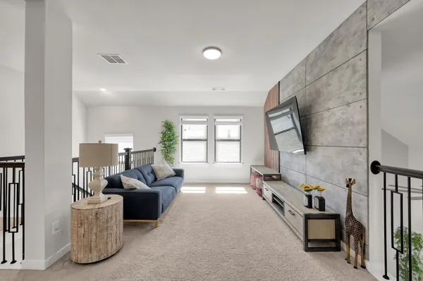a view of livingroom with furniture and windows