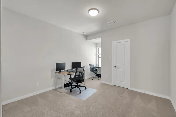 a bathroom with a granite countertop sink toilet mirror and shower