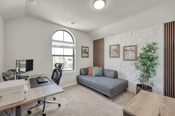 a bathroom with a granite countertop sink toilet tub and shower
