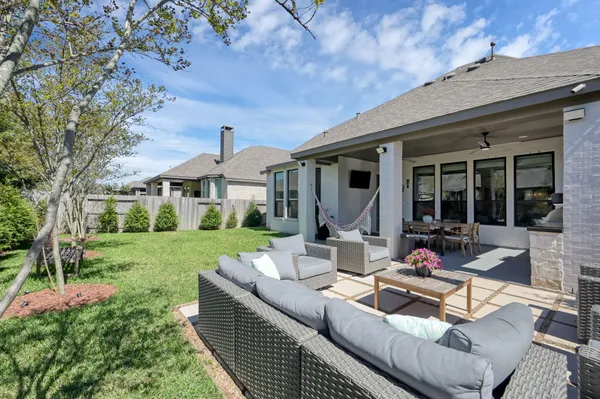 a front view of house with yard and outdoor seating