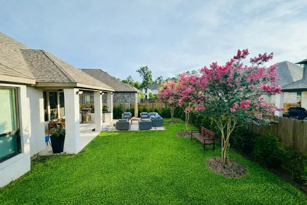 an aerial view of a houses with outdoor space