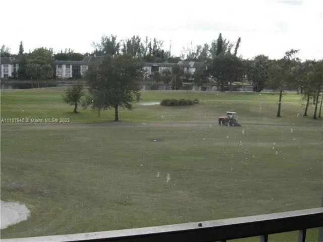 a view of a lake with a yard