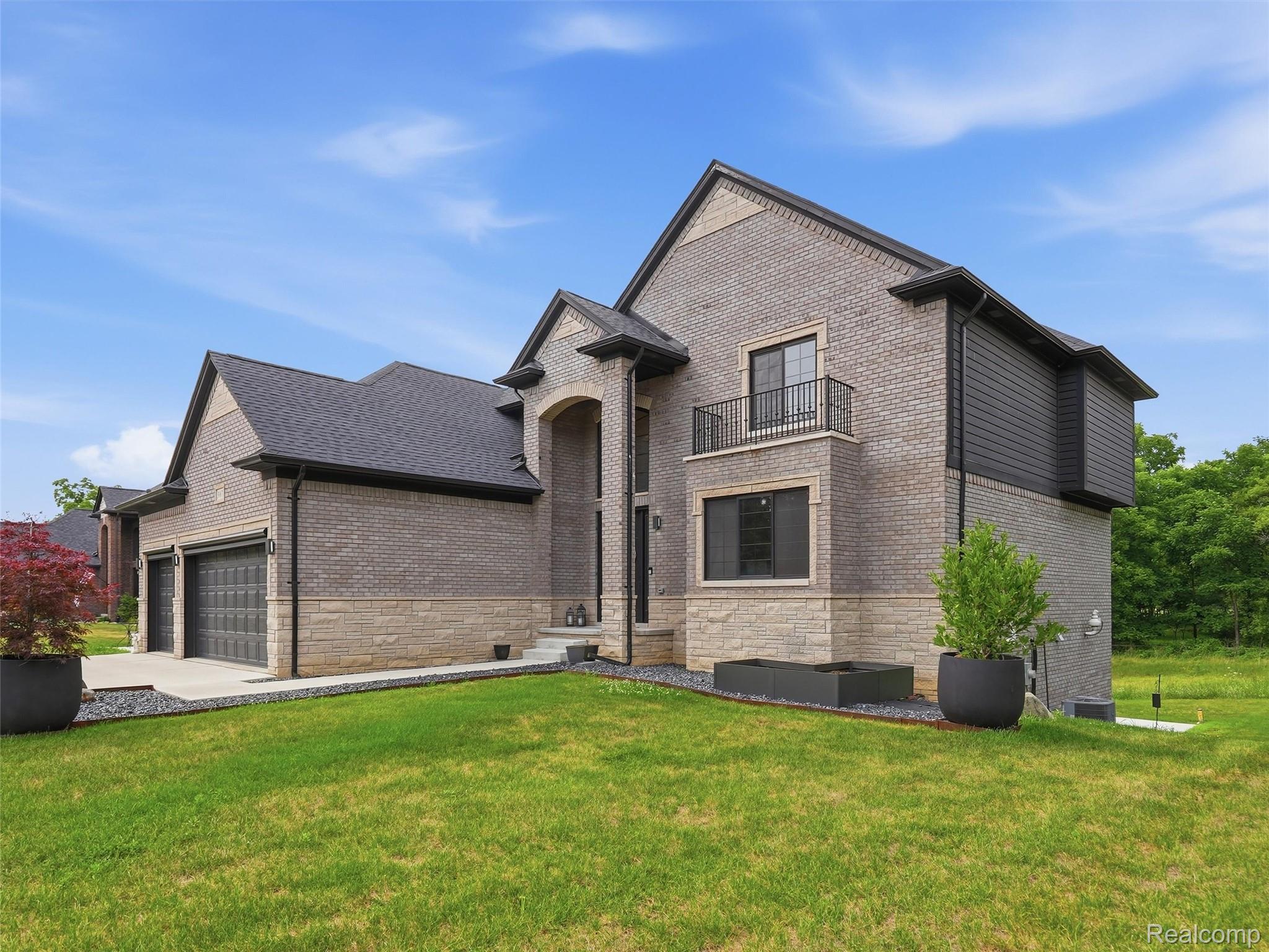 3007 28 Mile Road Washington, MI 48094 - Photo 60 of 69 Contemporary residence featuring a brick and stone facade with dark accent siding