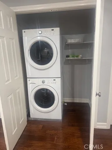 a view of a hallway with washer and dryer