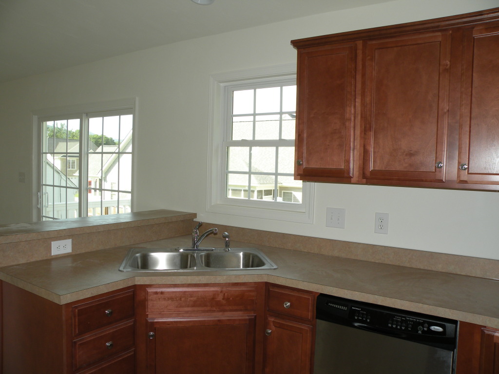 5537 Cove Road Roanoke, VA 24019 - Photo 12 of 28 a kitchen with granite countertop cabinets sink and window