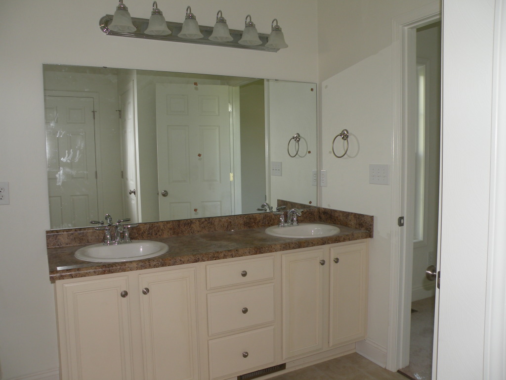 5537 Cove Road Roanoke, VA 24019 - Photo 18 of 28 a bathroom with a granite countertop sink and a mirror