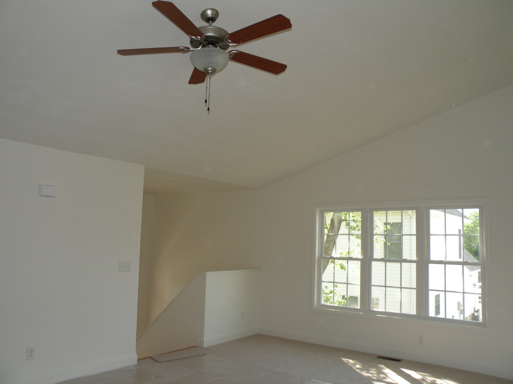 5537 Cove Road Roanoke, VA 24019 - Photo 4 of 28 an empty room with a window and a fan