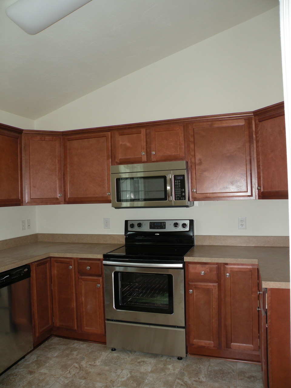 5537 Cove Road Roanoke, VA 24019 - Photo 9 of 28 a kitchen with stainless steel appliances a stove microwave and cabinets