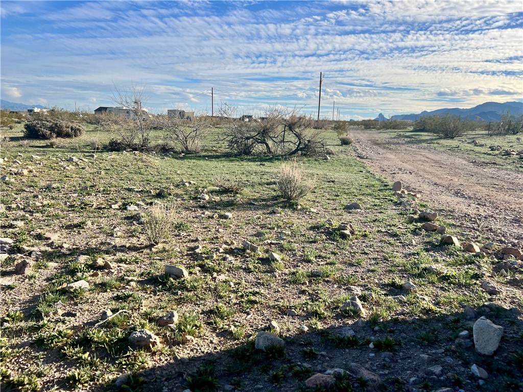 2884 Naco Road Golden Valley, AZ 86413 - Photo 7 of 14 View of yard with a mountain view and a view of countryside