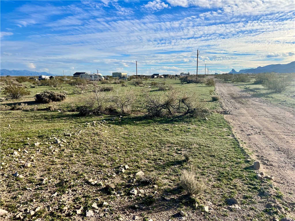 2884 Naco Road Golden Valley, AZ 86413 - Photo 8 of 14 View of yard with a mountain view and a rural view