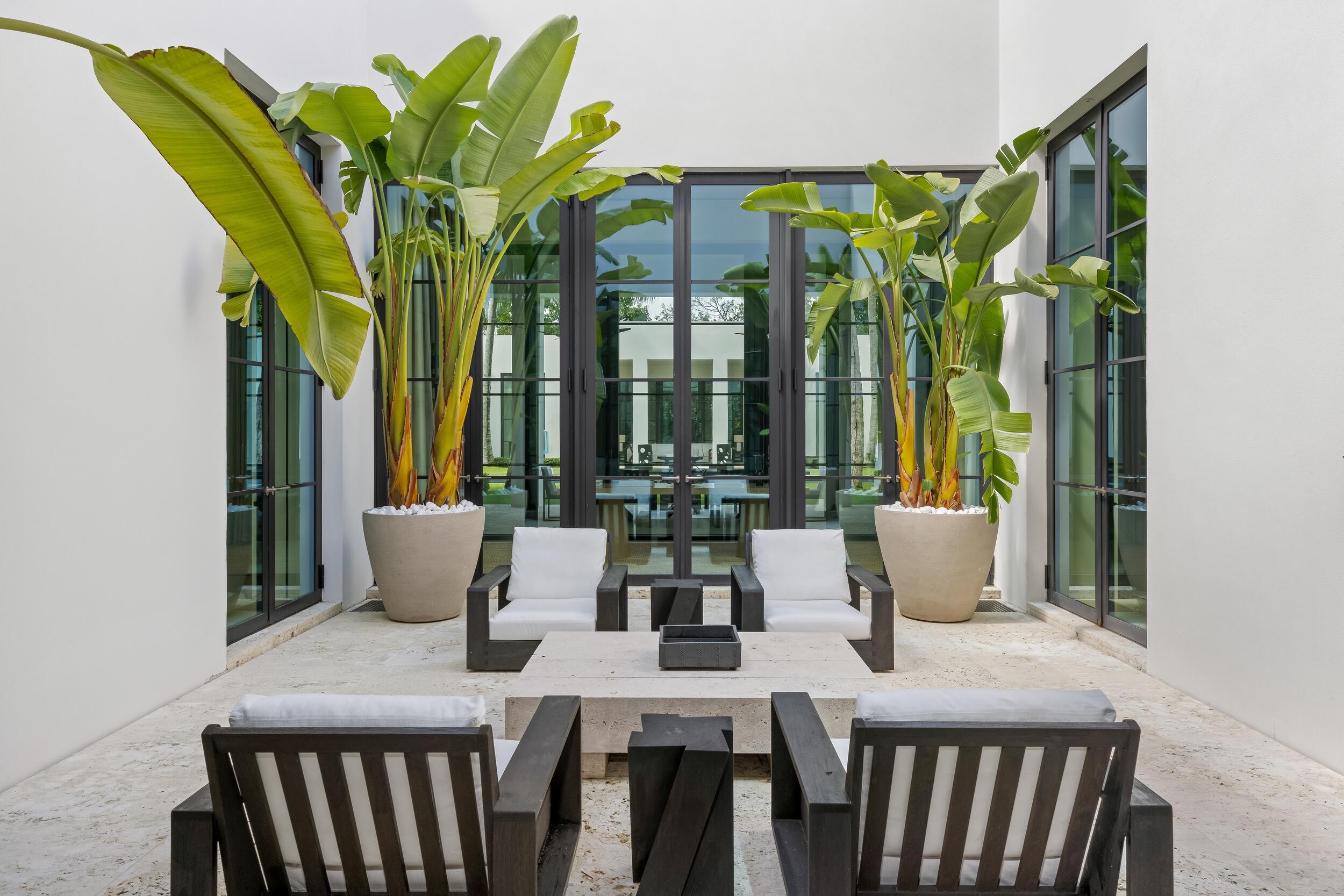 241 Jungle Road Palm Beach, FL 33480 - Photo 14 of 96 a view of a dining room with furniture and window