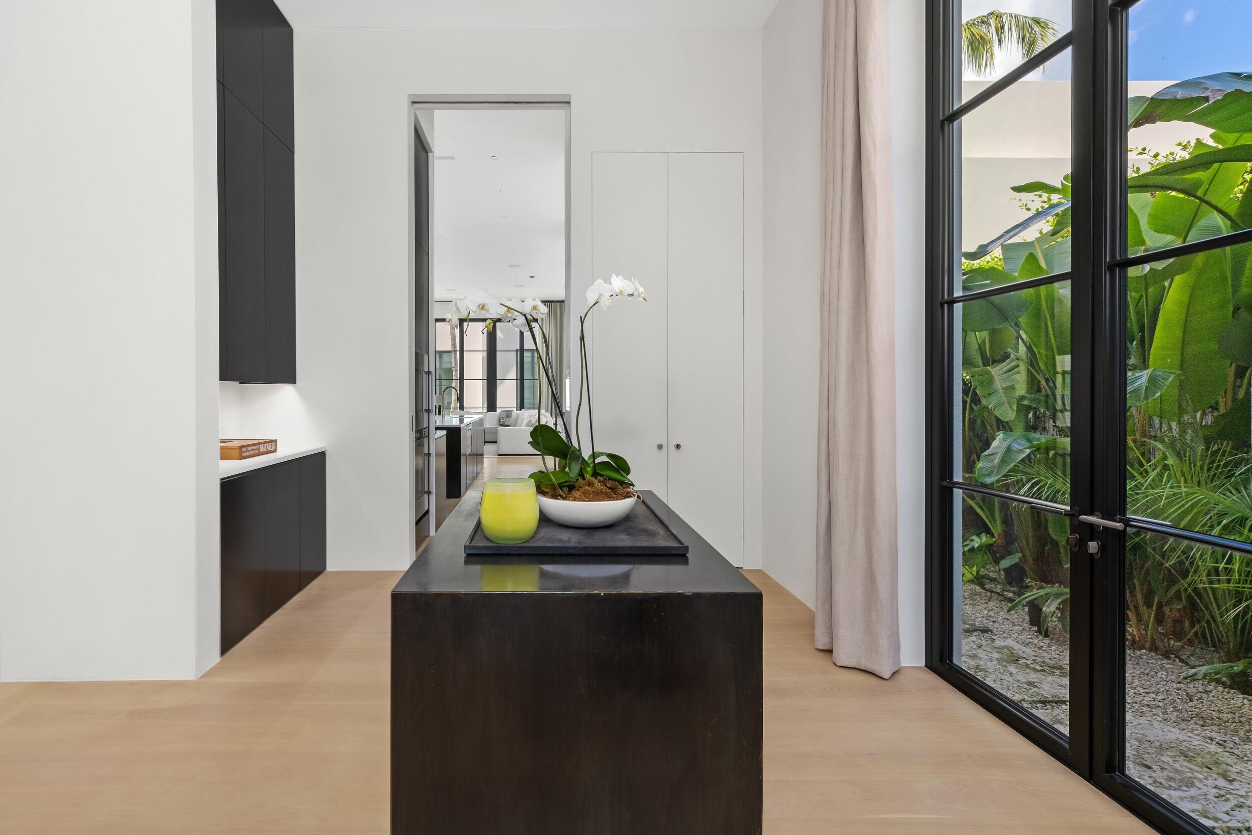 241 Jungle Road Palm Beach, FL 33480 - Photo 24 of 96 a bathroom with a sink and a mirror