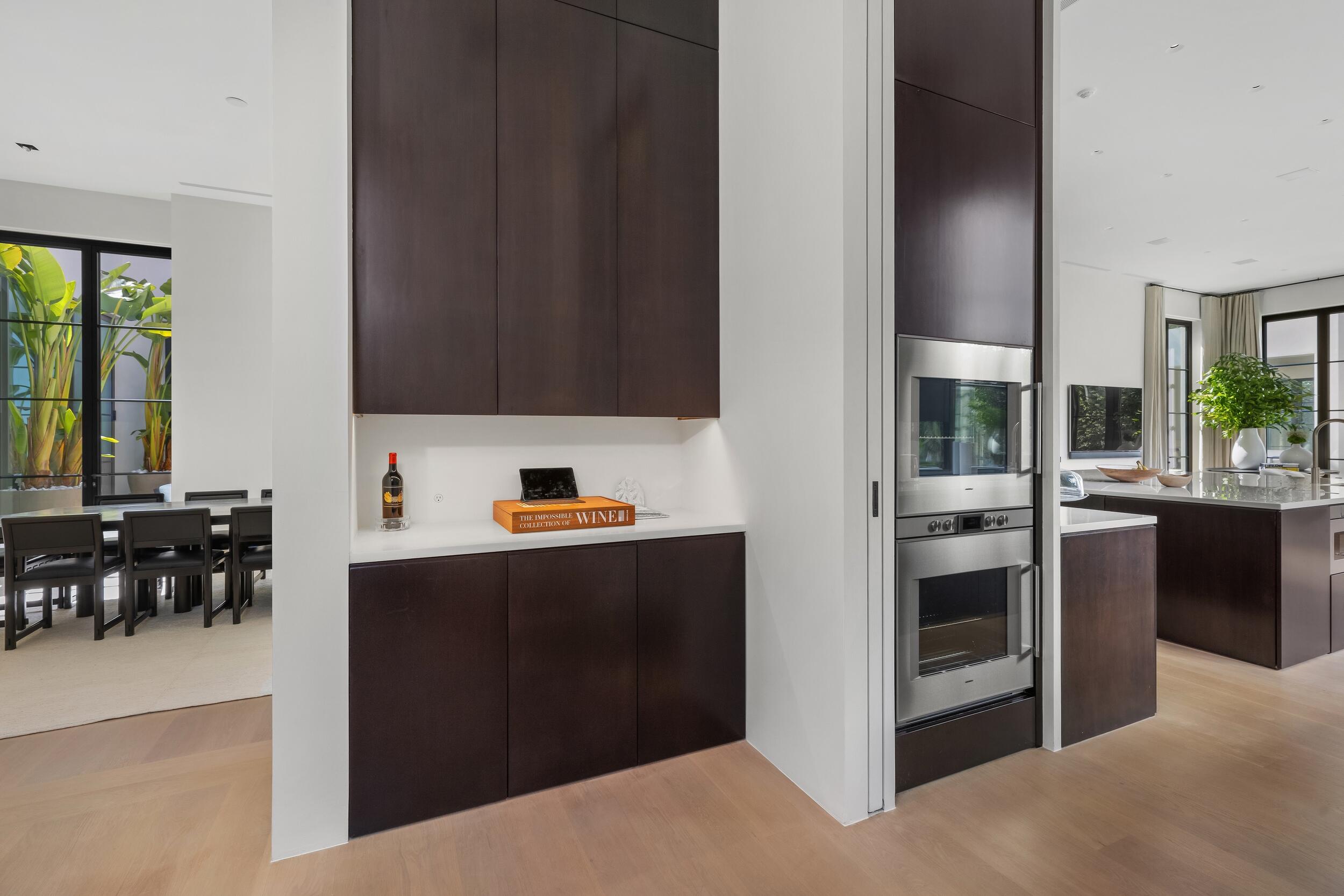 241 Jungle Road Palm Beach, FL 33480 - Photo 25 of 96 a kitchen with stainless steel appliances kitchen island granite countertop a refrigerator and a stove top oven