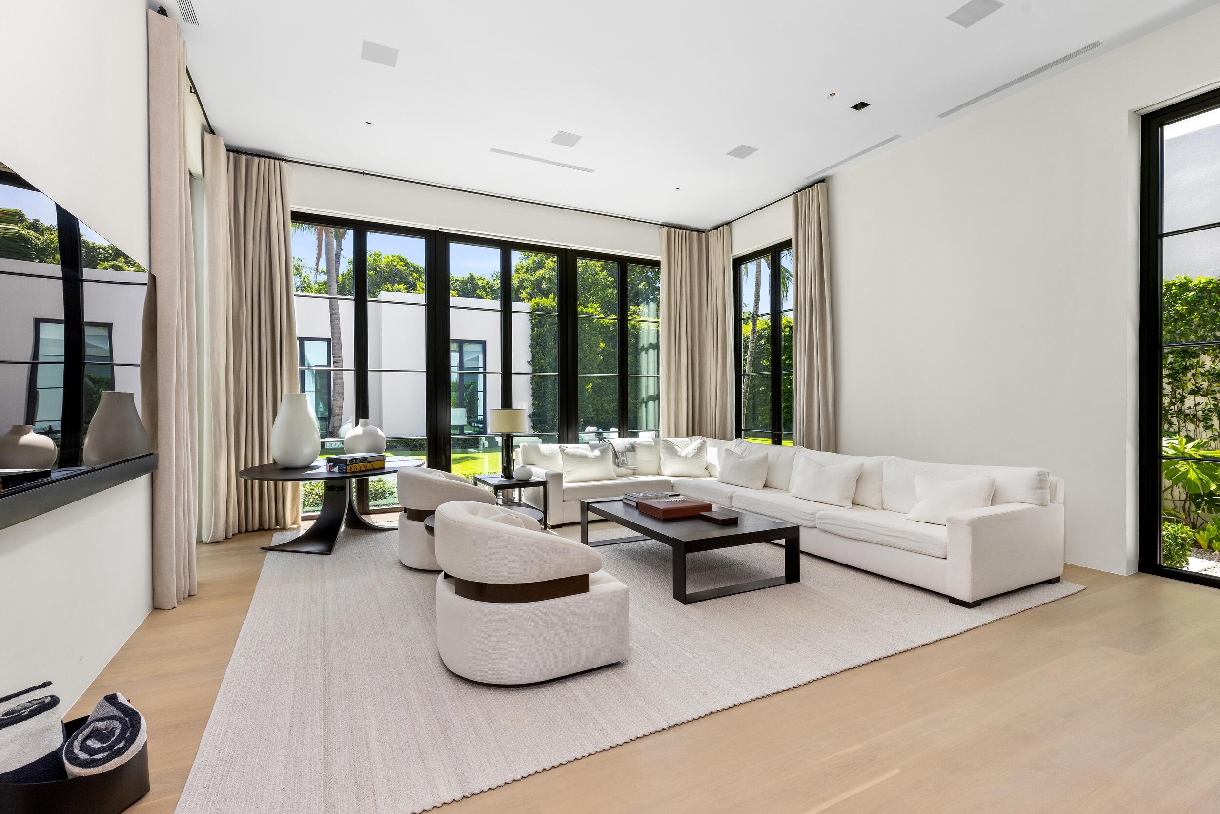 241 Jungle Road Palm Beach, FL 33480 - Photo 34 of 96 a living room with furniture and a large window