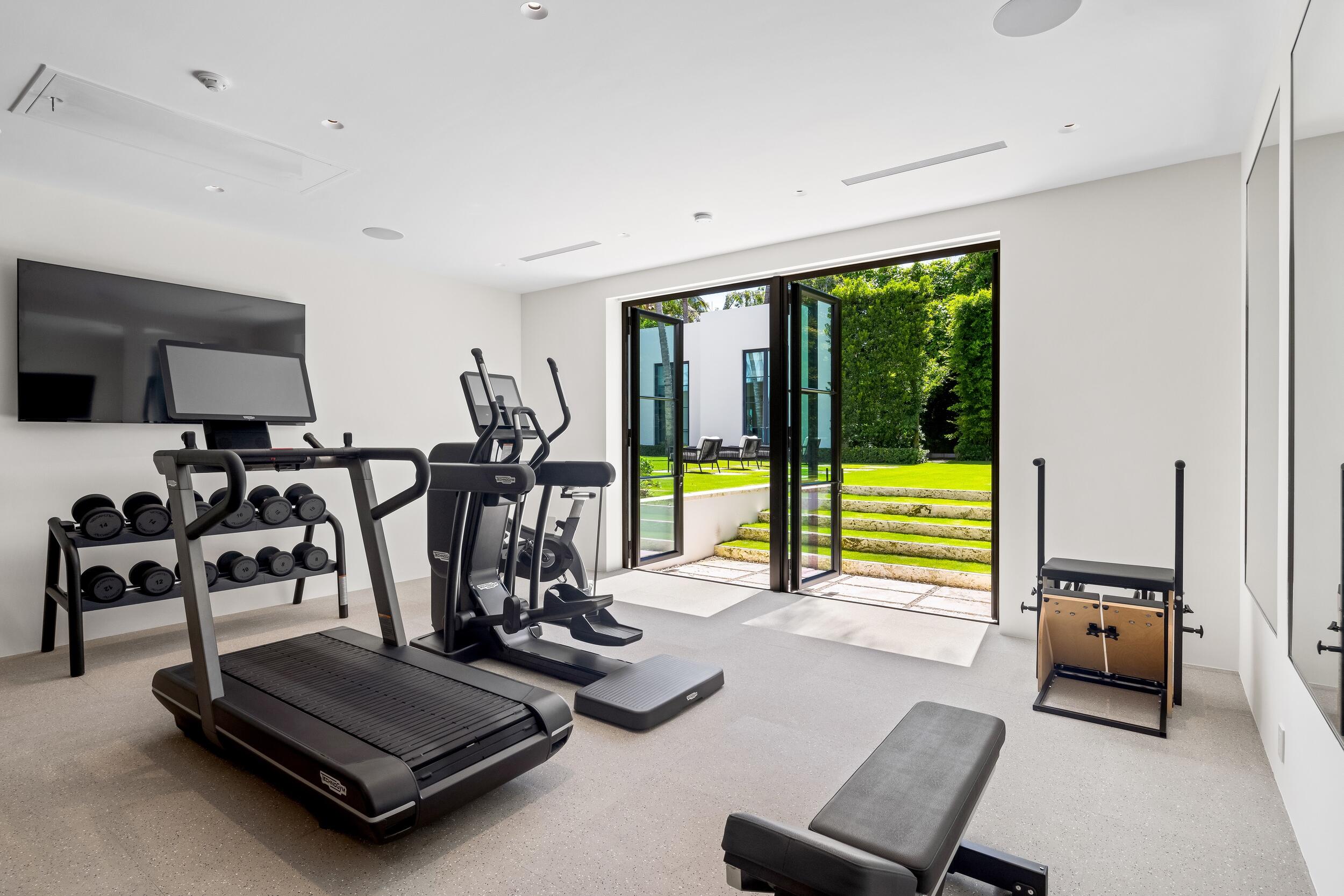 241 Jungle Road Palm Beach, FL 33480 - Photo 41 of 96 a view of a room with gym equipment