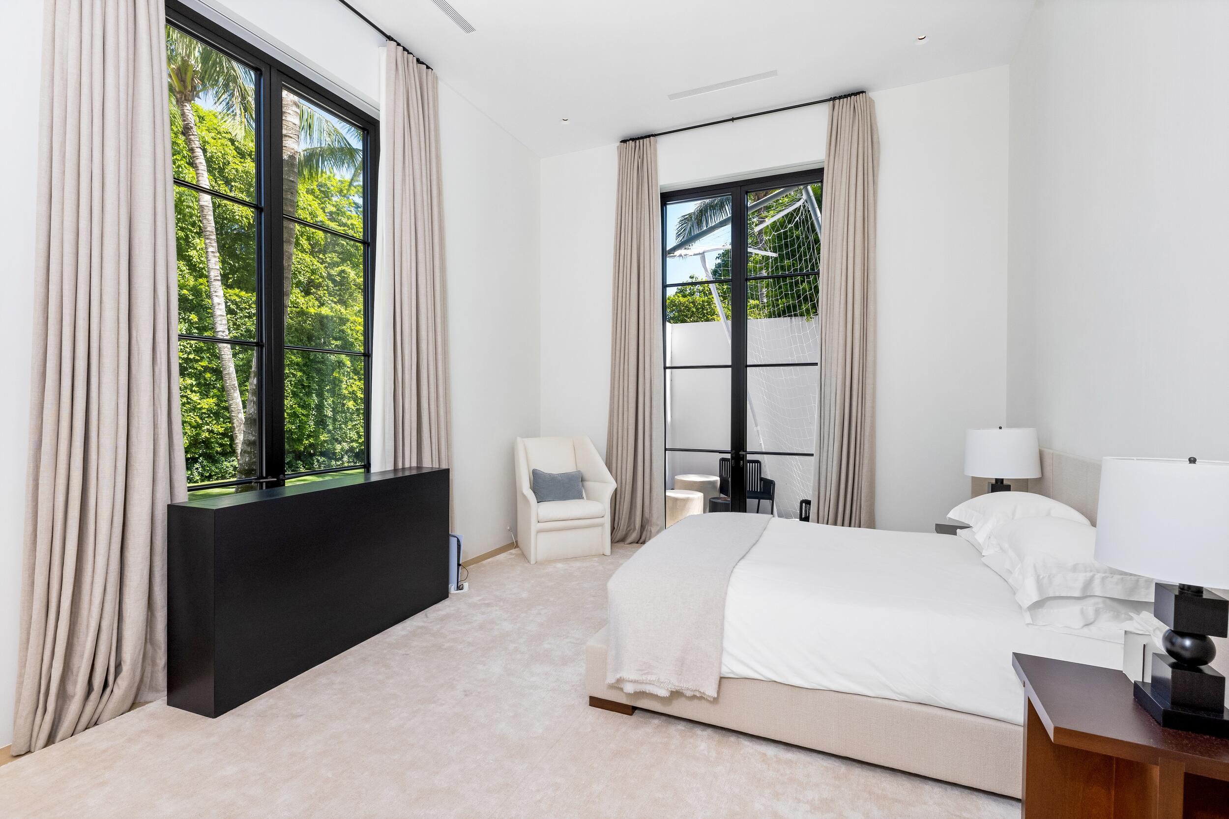 241 Jungle Road Palm Beach, FL 33480 - Photo 56 of 96 a bedroom with a bed and a window