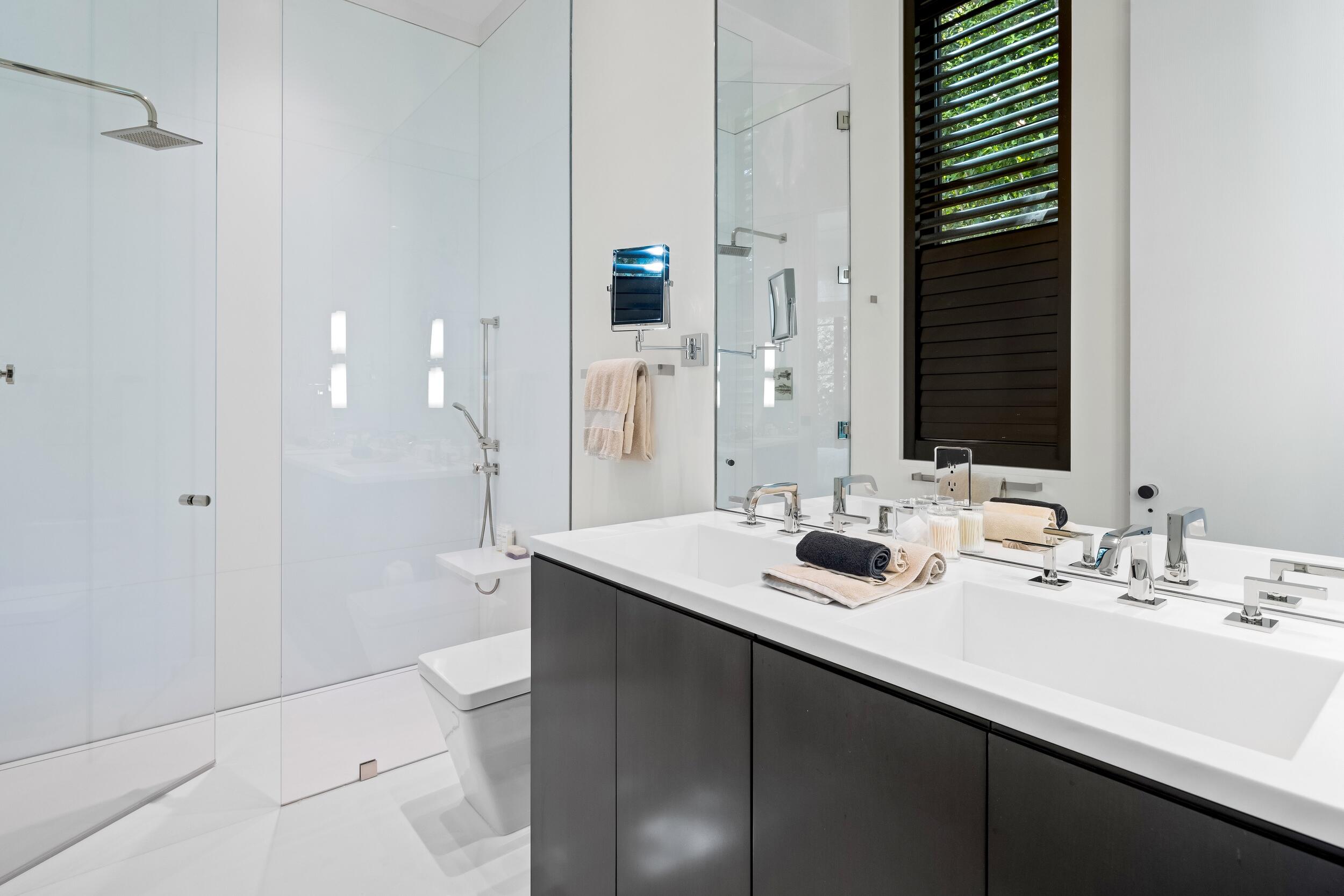 241 Jungle Road Palm Beach, FL 33480 - Photo 59 of 96 a bathroom with a sink and a mirror
