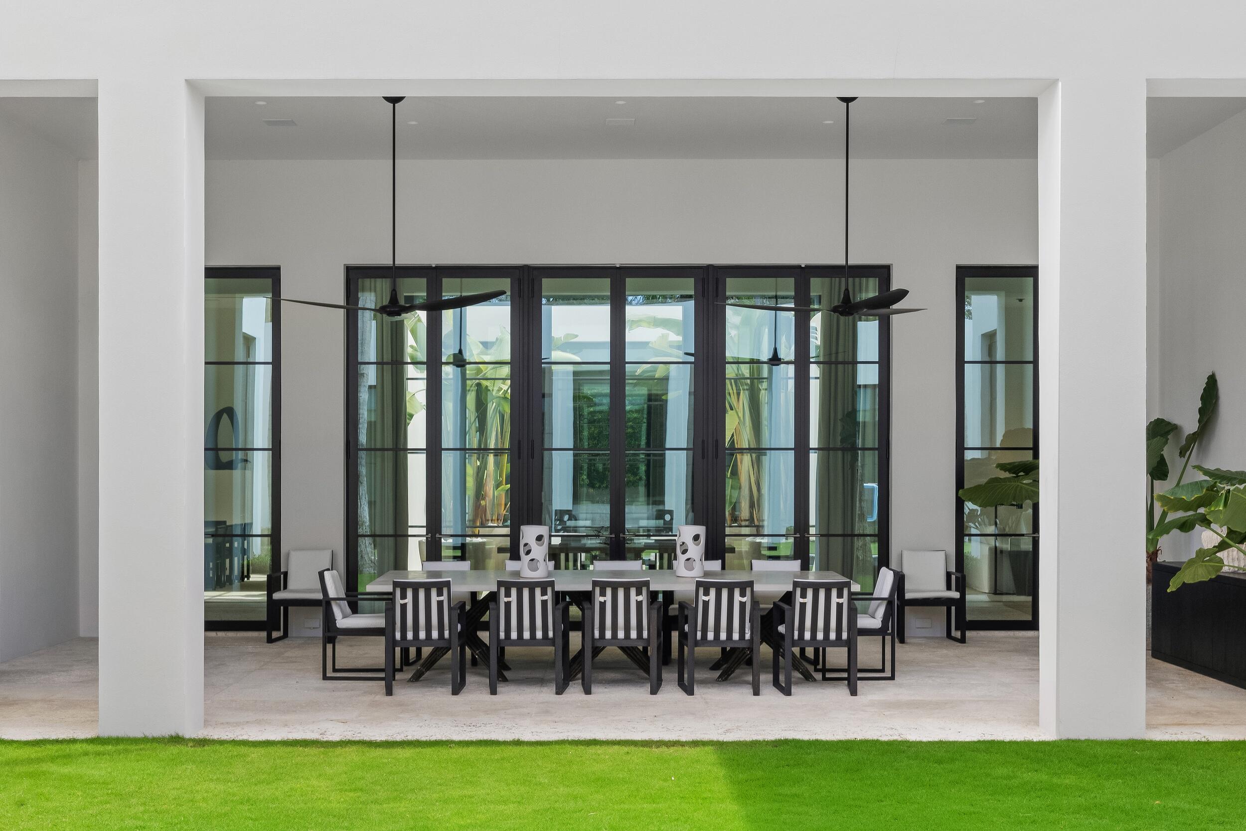 241 Jungle Road Palm Beach, FL 33480 - Photo 65 of 96 a view of dining room with lots of furniture and floor to ceiling window