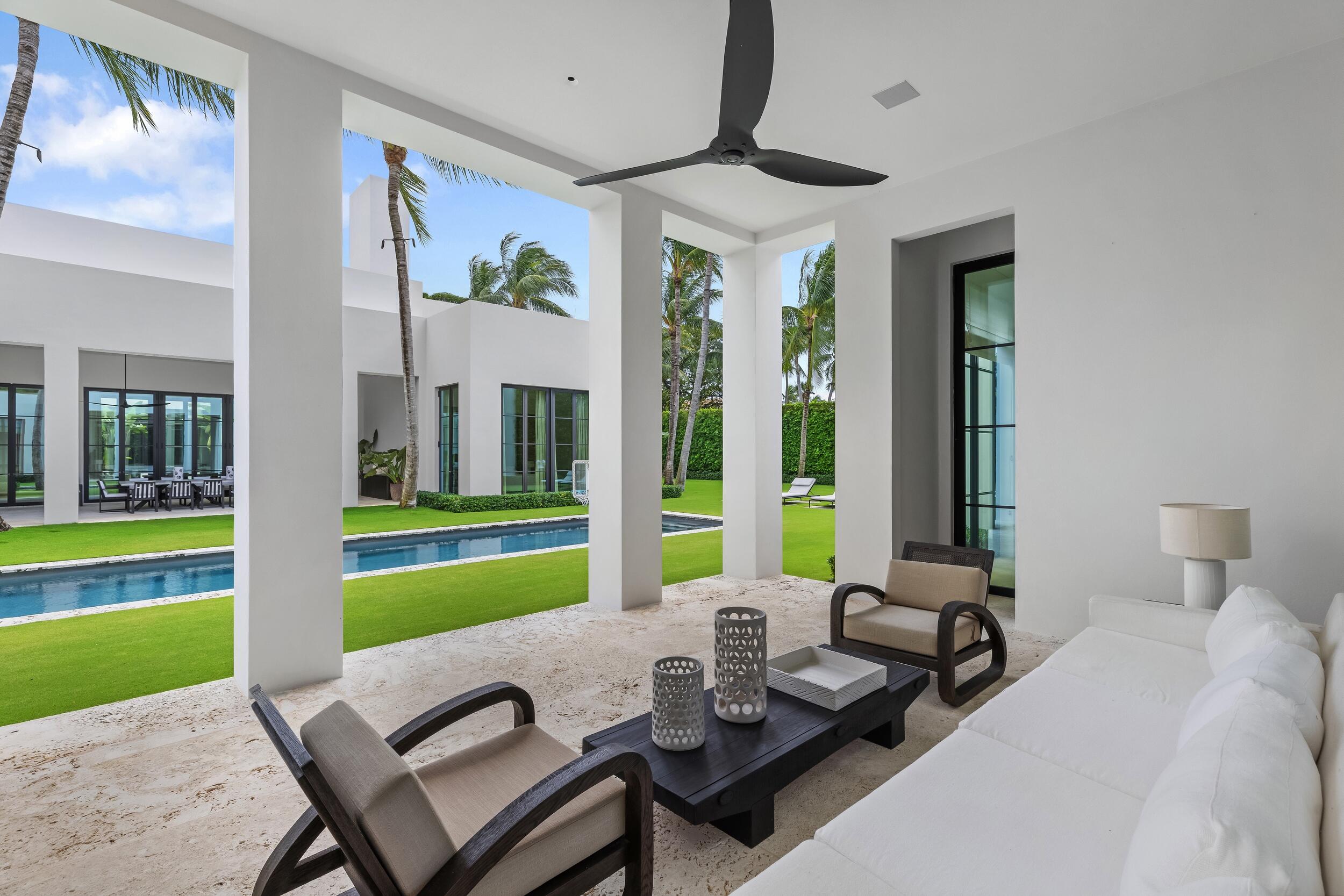 241 Jungle Road Palm Beach, FL 33480 - Photo 71 of 96 a living room with furniture and a large window