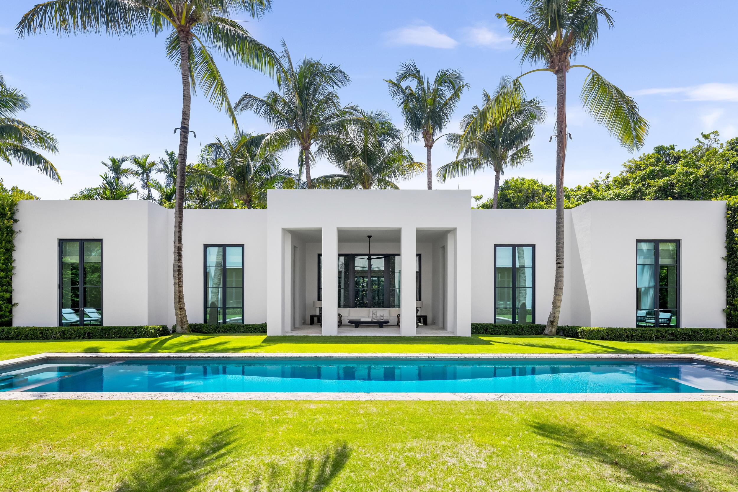 241 Jungle Road Palm Beach, FL 33480 - Photo 76 of 96 a view of swimming pool with palm trees