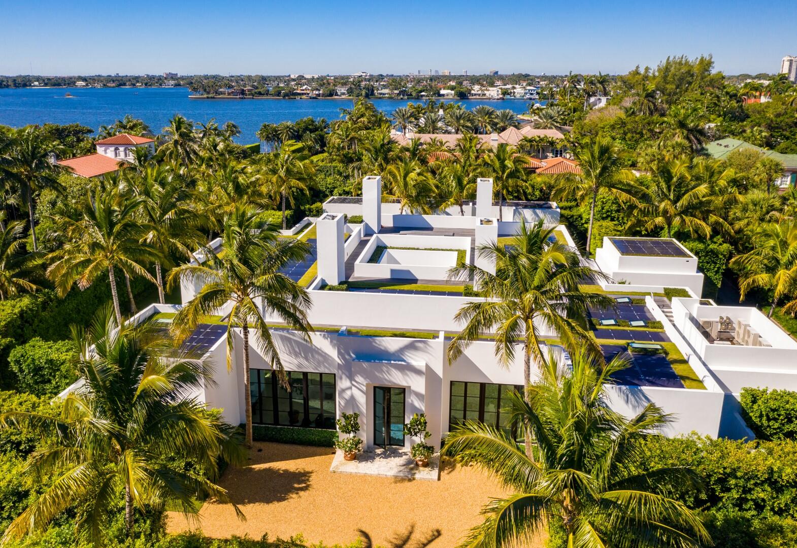 241 Jungle Road Palm Beach, FL 33480 - Photo 86 of 96 an aerial view of a house with a yard and mountain view in back