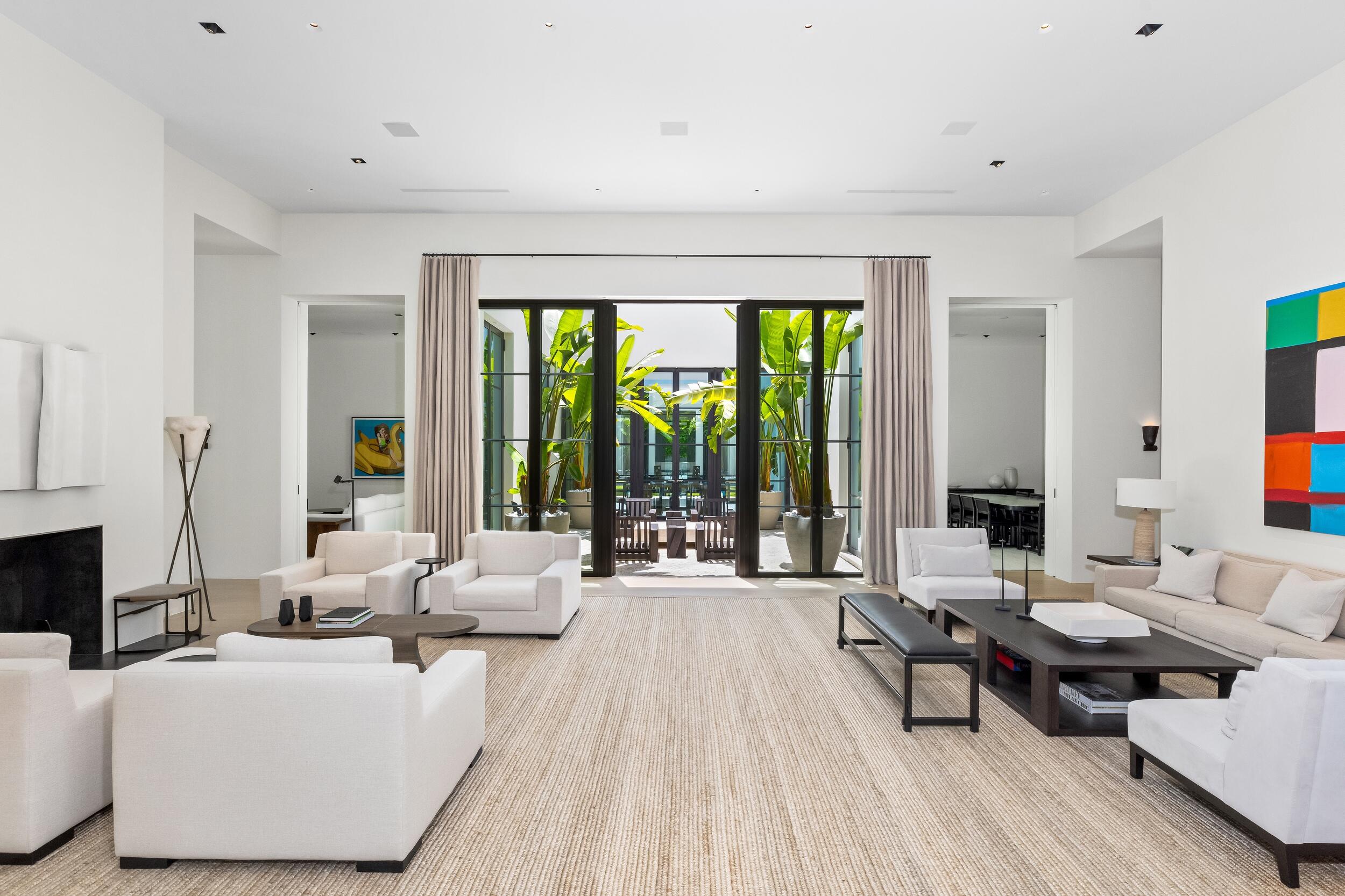 241 Jungle Road Palm Beach, FL 33480 - Photo 9 of 96 a living room with furniture and large windows
