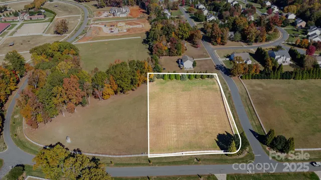 an aerial view of a residential houses with outdoor space
