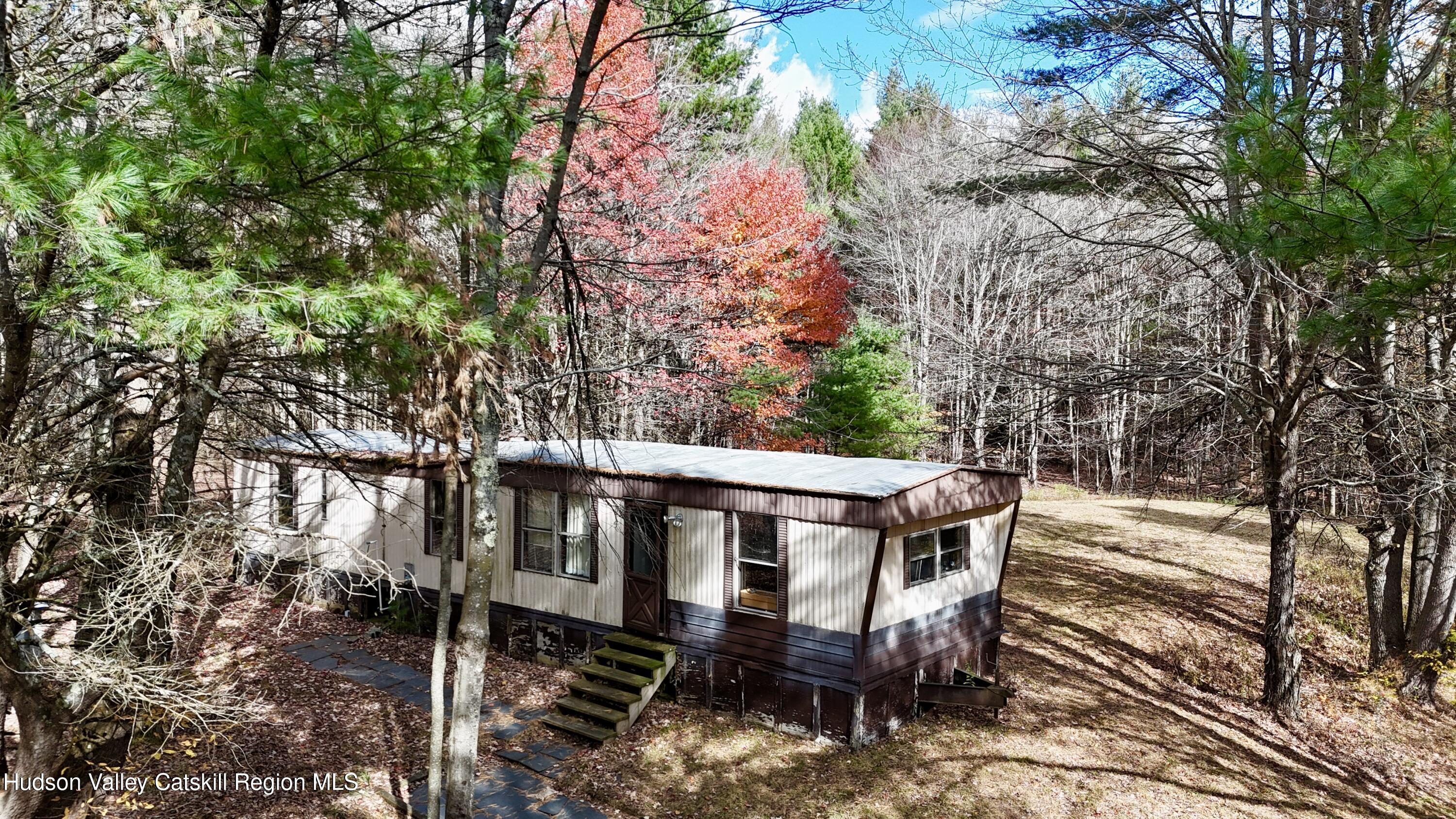 238 Buel Road Gilboa, NY 12076 - Photo 2 of 13 a view of a patio with table and chairs and potted plants