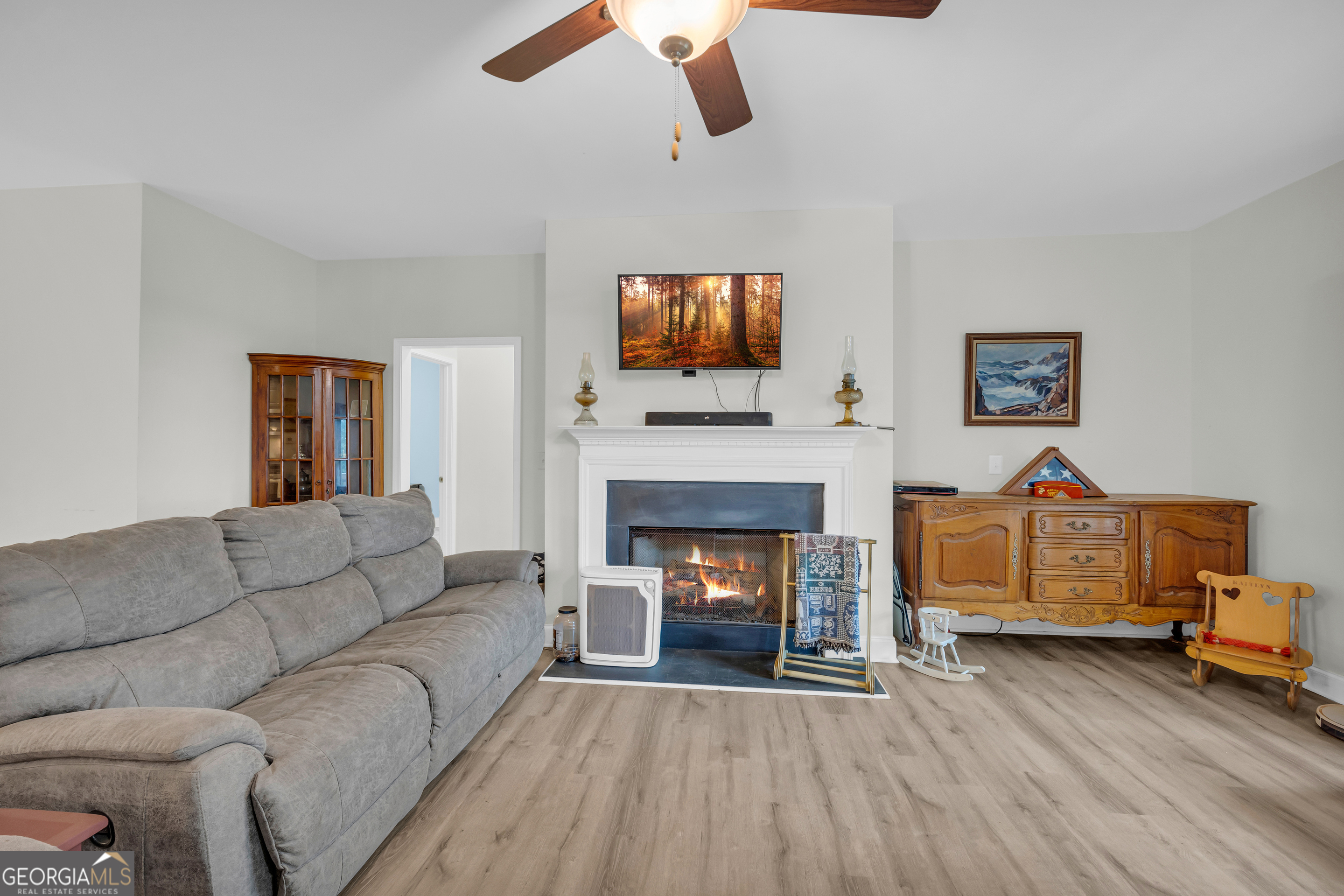 945 Hank Fry Road Clarkesville, GA 30523 - Photo 15 of 45 a living room with furniture and a fireplace