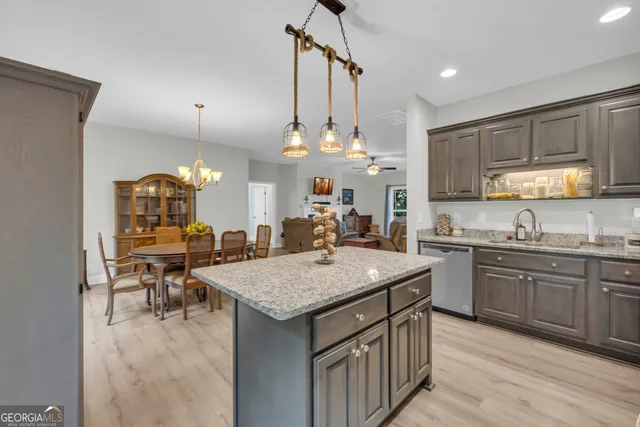 a kitchen with a sink stove and wooden cabinets