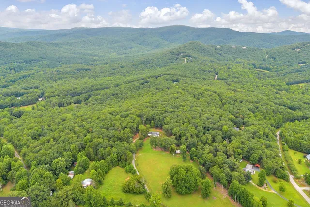 a view of a lake in a field