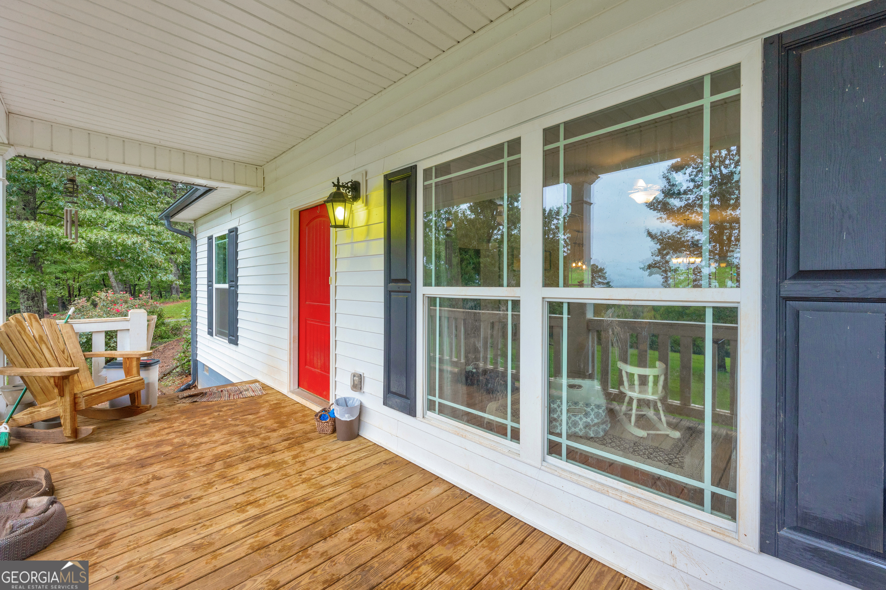 945 Hank Fry Road Clarkesville, GA 30523 - Photo 9 of 45 a bedroom with a large window and a balcony