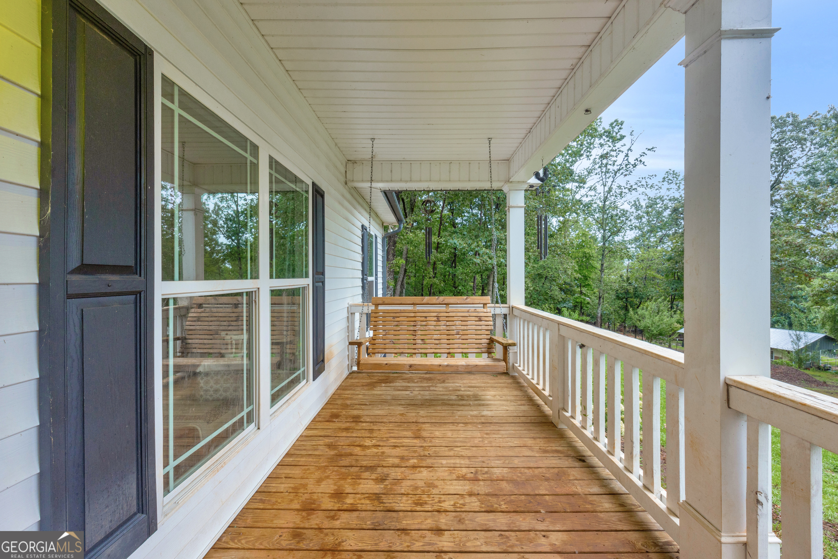 945 Hank Fry Road Clarkesville, GA 30523 - Photo 10 of 45 a view of a porch with wooden floor and outdoor space