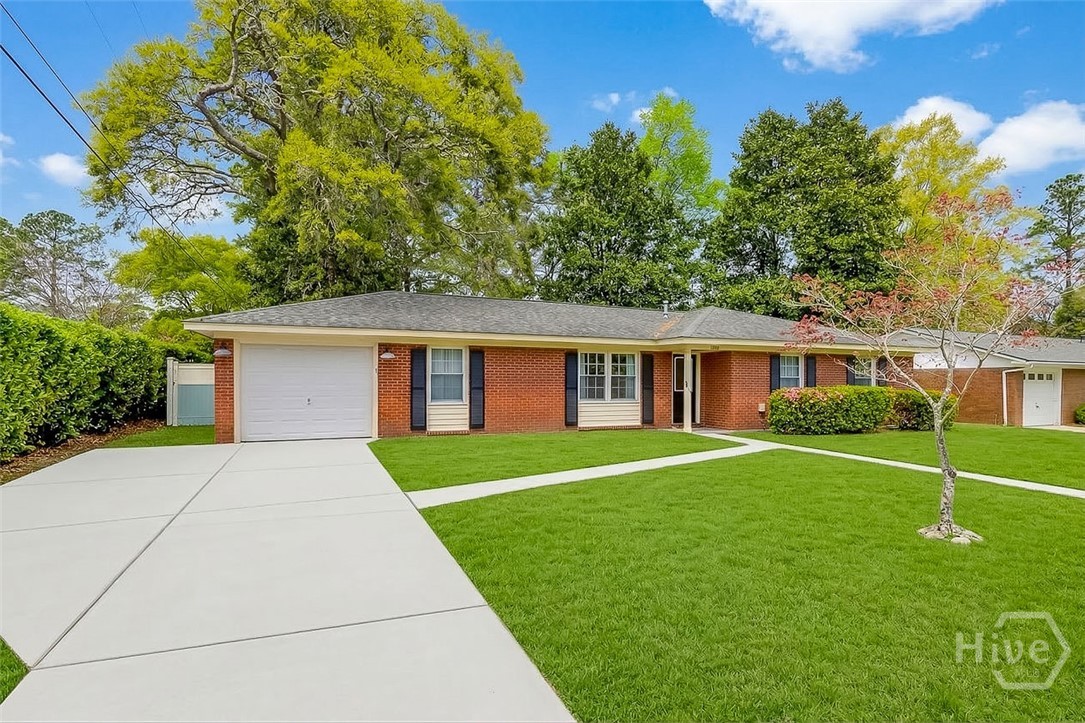 12606 Sunnybrook Road Savannah, GA 31419 - Photo 3 of 40 Extra parking space and single car garage * enhanced grass picture*
