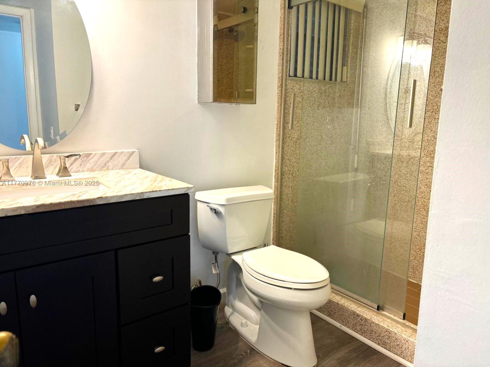 7300 Wayne Avenue, Unit 511 Miami Beach, FL 33141 - Photo 12 of 20 a bathroom with a sink a toilet and shower