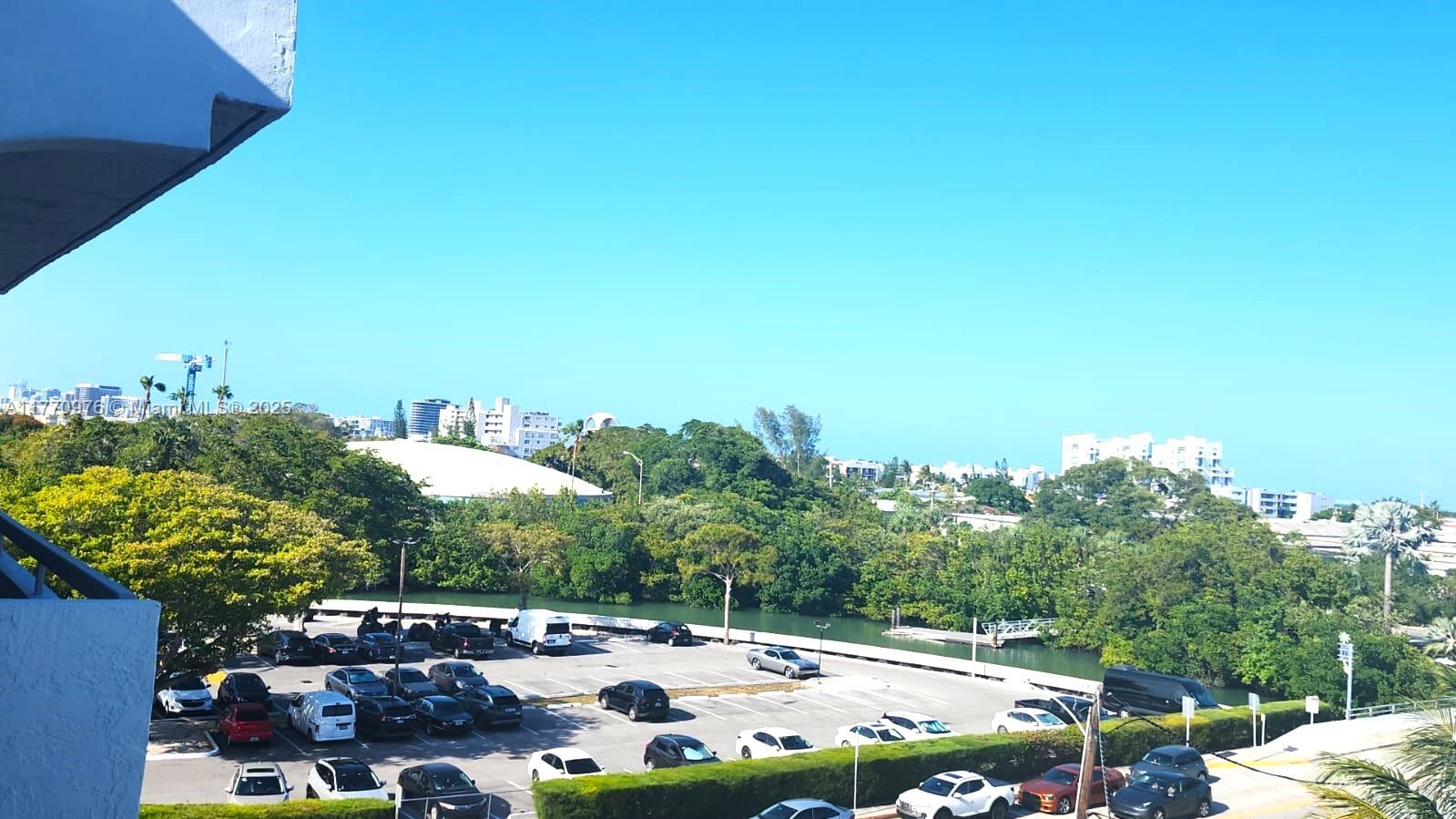 7300 Wayne Avenue, Unit 511 Miami Beach, FL 33141 - Photo 18 of 20 a view of a swimming pool patio and outdoor seating