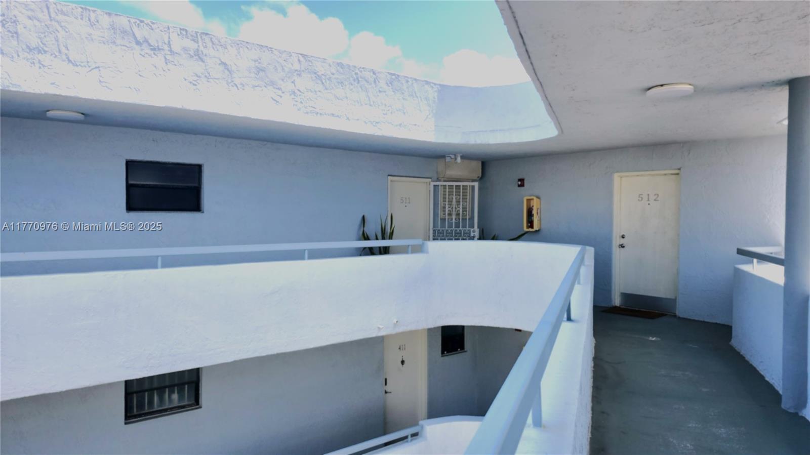 7300 Wayne Avenue, Unit 511 Miami Beach, FL 33141 - Photo 4 of 20 a room with a table and chairs