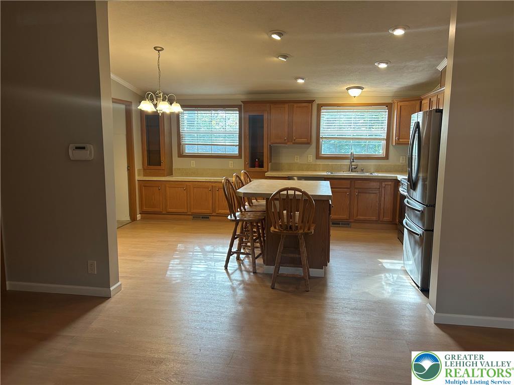 4220 Panther Court Orefield, PA 18069 - Photo 5 of 21 a view of a a dining room with furniture window and wooden floor