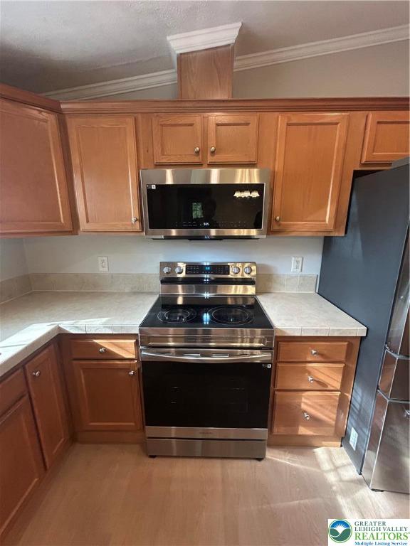 4220 Panther Court Orefield, PA 18069 - Photo 6 of 21 a stove top oven sitting inside of a kitchen