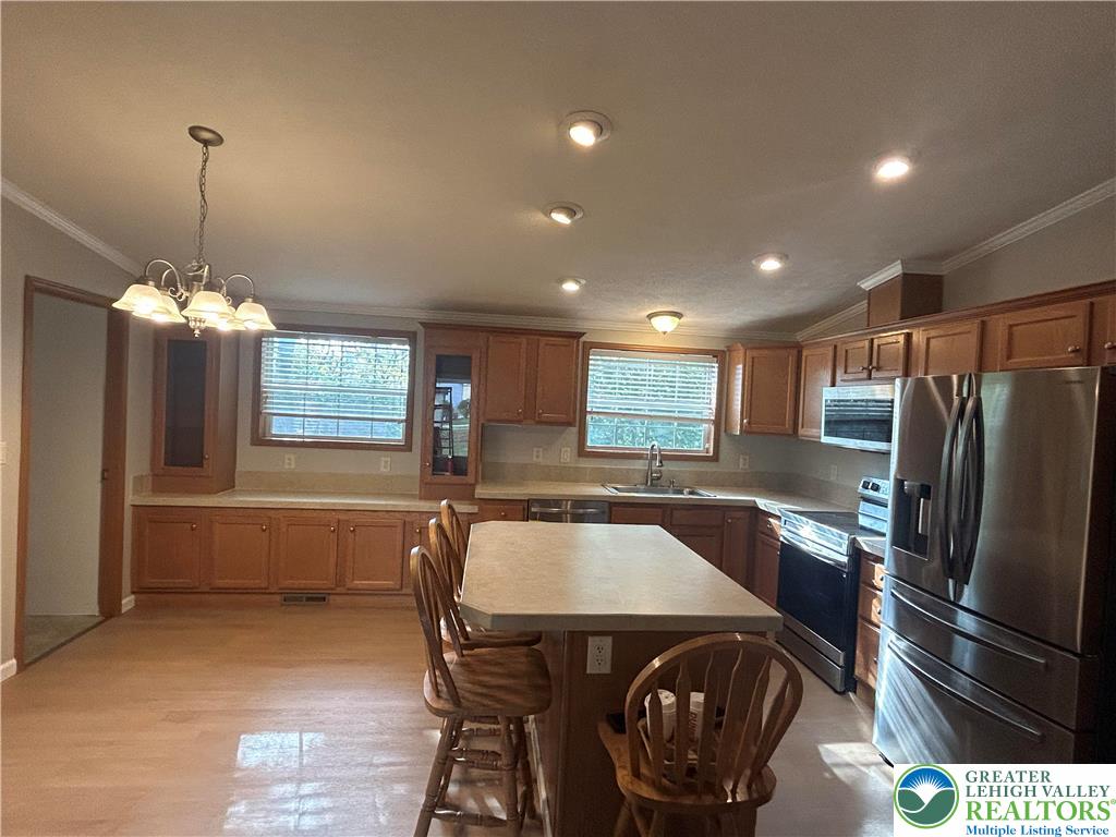 4220 Panther Court Orefield, PA 18069 - Photo 9 of 21 a view of a dining room with furniture window and wooden floor