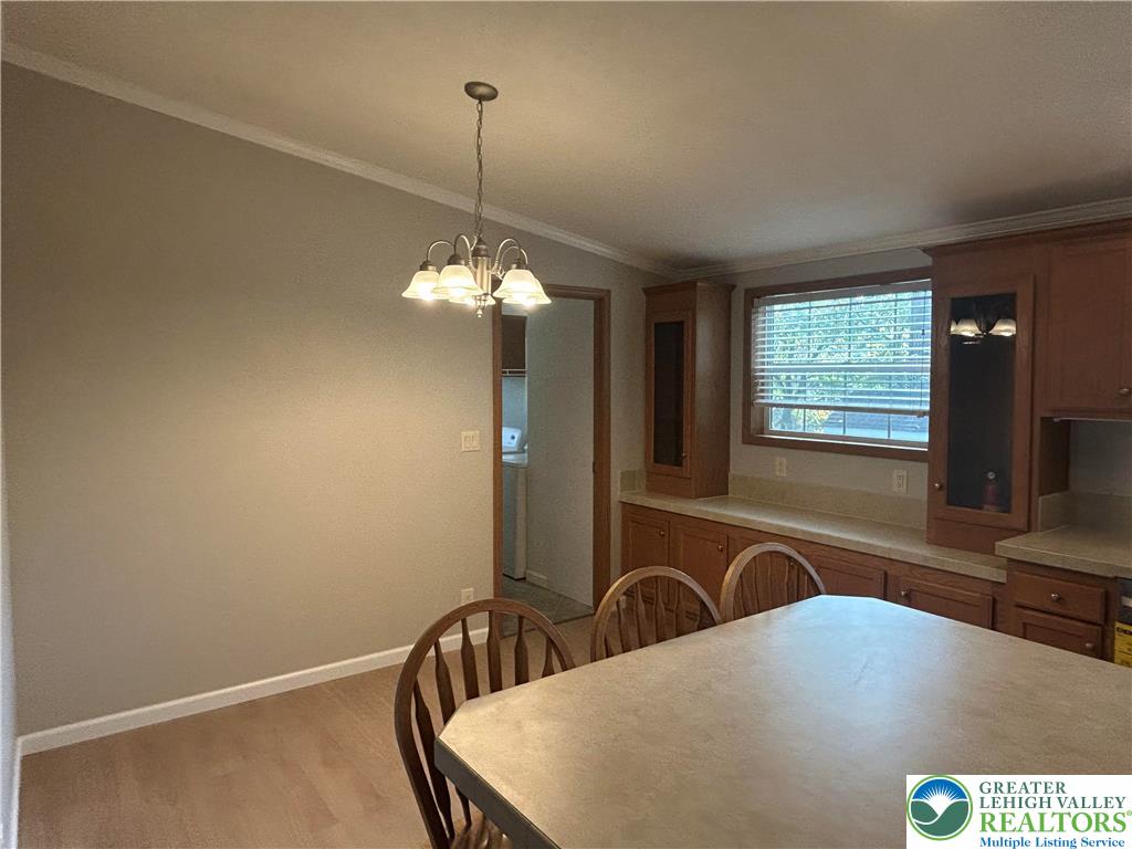 4220 Panther Court Orefield, PA 18069 - Photo 10 of 21 a view of a room with a chandelier furniture and windows