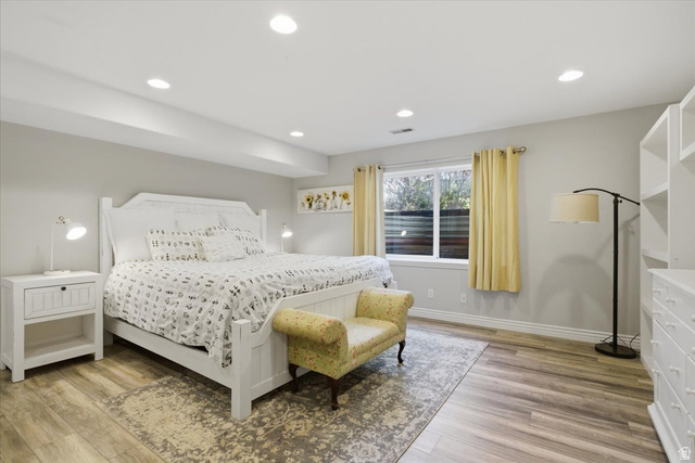 12317 Cypress Point Way Draper, UT 84020 - Photo 31 of 41 Spacious room featuring wood-finish flooring, recessed lighting, and a large window