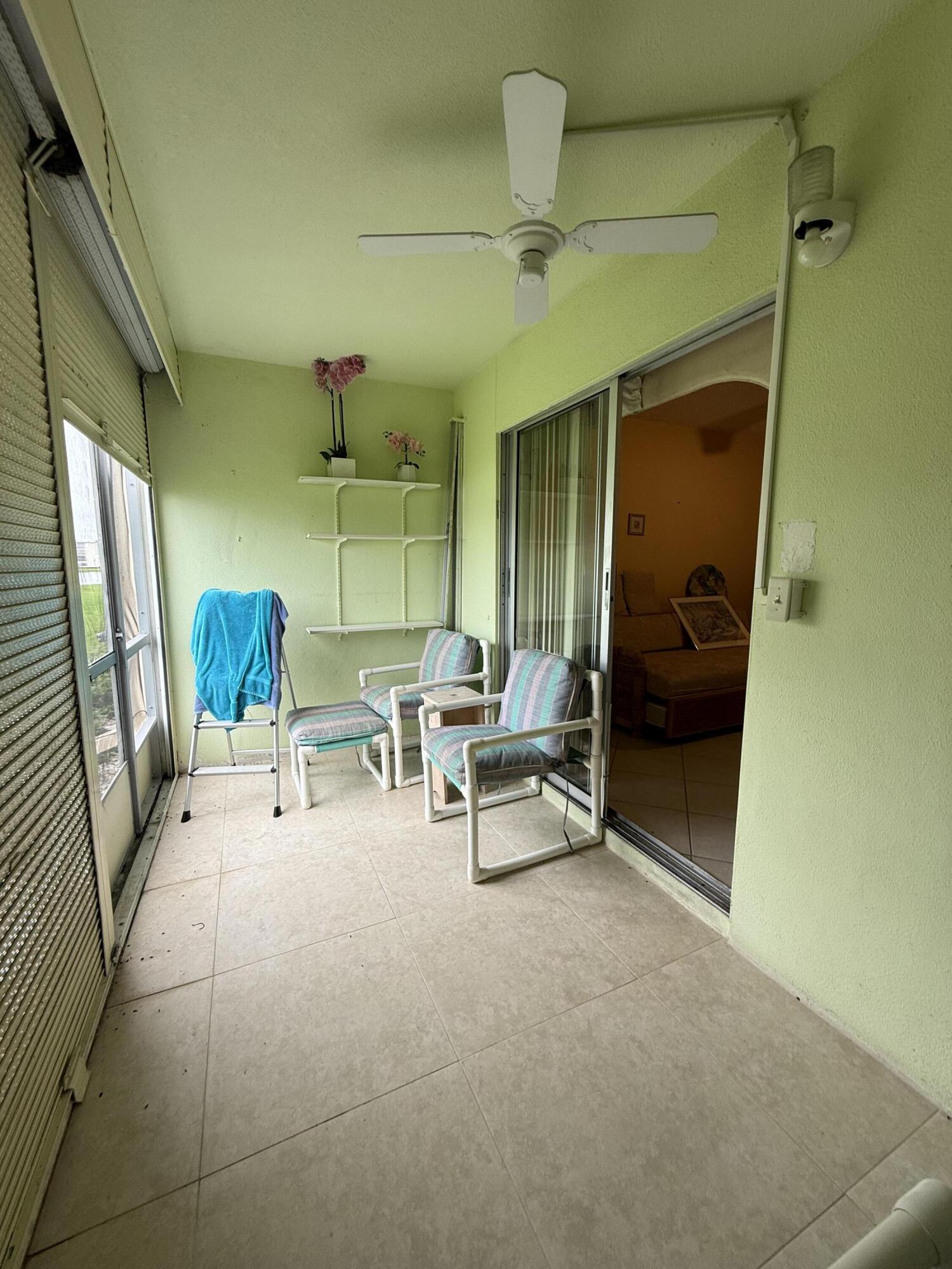 1046 Wolverton C Boca Raton, FL 33434 - Photo 15 of 17 a view of living room with furniture and a window