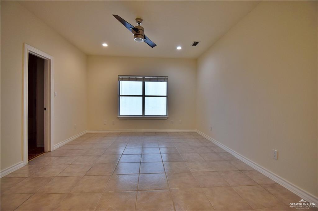 1104 Rio Balsas Mission, TX 78572 - Photo 12 of 20 Empty room featuring light tile patterned floors, recessed lighting, and a ceiling fan