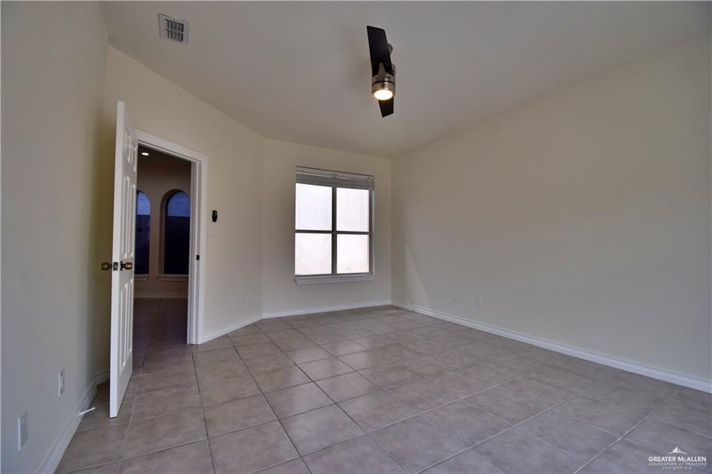 1104 Rio Balsas Mission, TX 78572 - Photo 13 of 20 Unfurnished room with baseboards and light tile patterned flooring